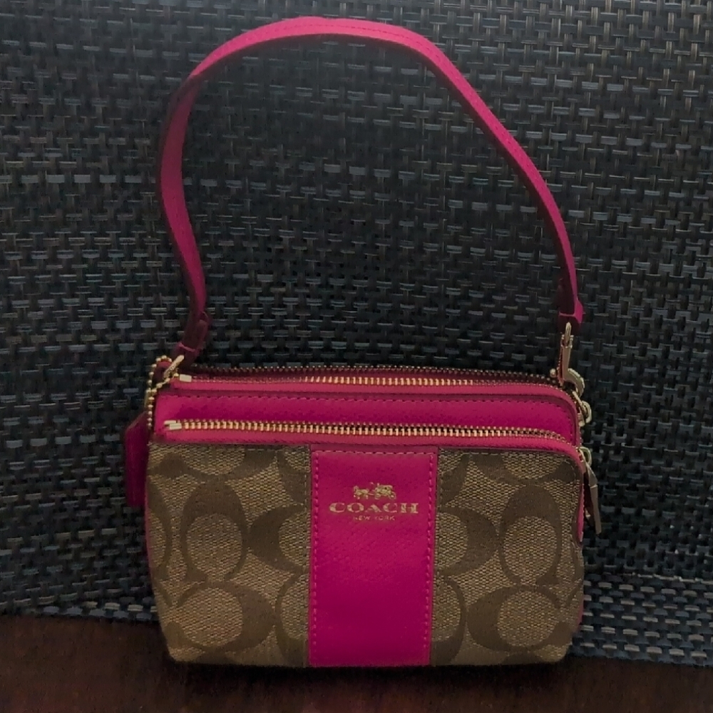 Bright and Stylish Coach Fuchsia and Tan compact Purse.
